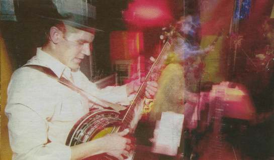 Geb playing banjo w/ the International Tussler Society in winter 2001